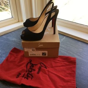 Classic black satin Christian Loubiutin’s pumps